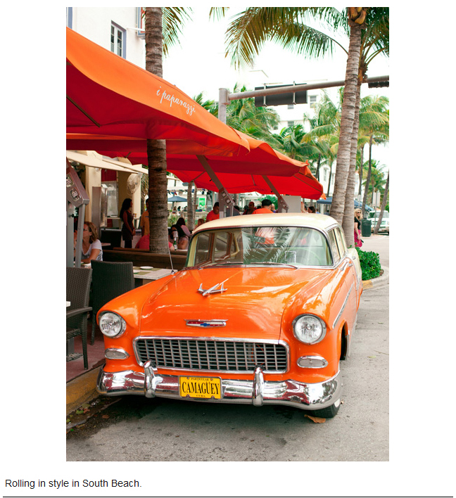 Rolling in style in South Beach, orange classic car